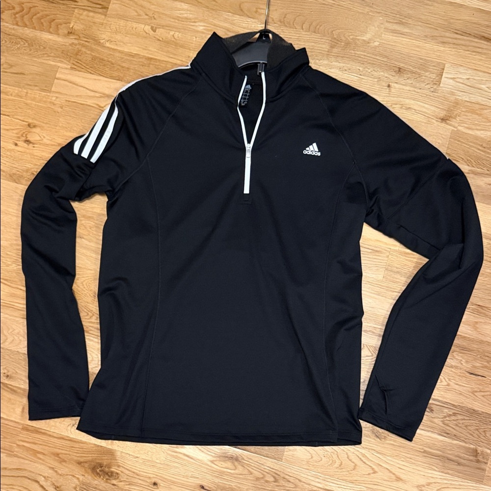Adidas Women’s Black Golf Performance Jacket with White Accents.